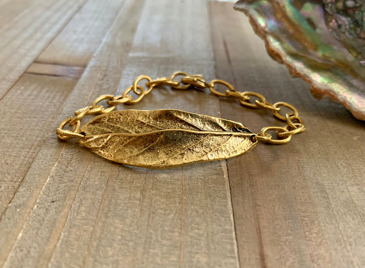 Nature Chic textured gold chain and artisan leaf bracelet